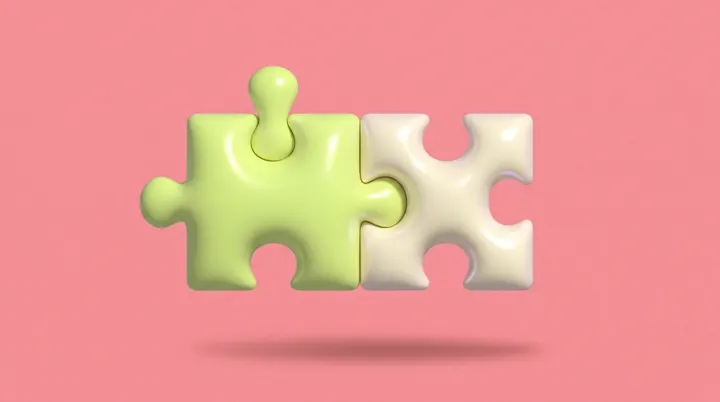 Duas peças de quebra-cabeça infláveis, verde-lima e creme, encaixadas sobre fundo rosa.